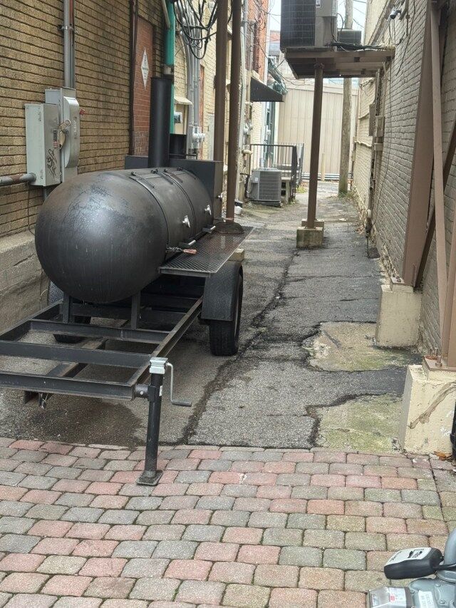 smoker in an alley in a city